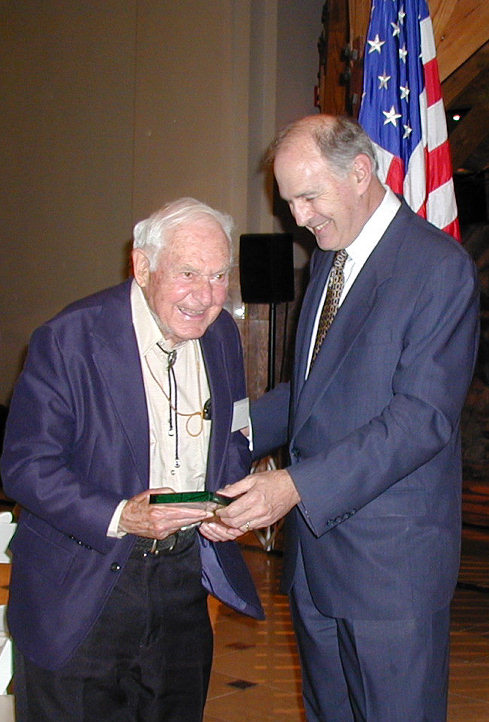 George Brett (left) receives his citation for induction in to the United States Stamp Society/Bureau Issues Association Hall of Fame from Chairman Roger Brody.