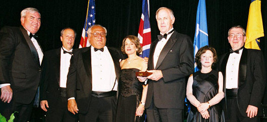 Roger Brody accepting Philatelic Achievement Award for George Brett; left to right, Postmaster General John Potter, NPM Director Allen Kane, Mr. & Mrs. Arthur Morowitz, USSS Chairman Roger Brody, Mr. & Mrs. Harvey Bennett.